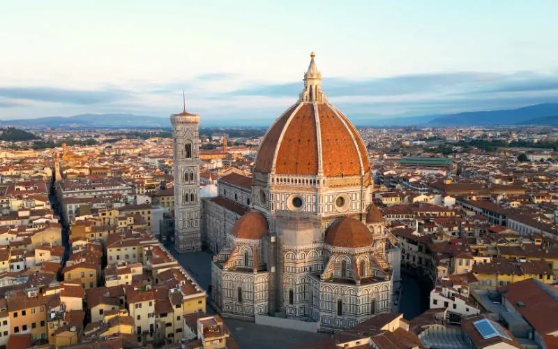 Aerial view of Florence Cathedral or Duomo di Firenze, sunset golden hour, Italy